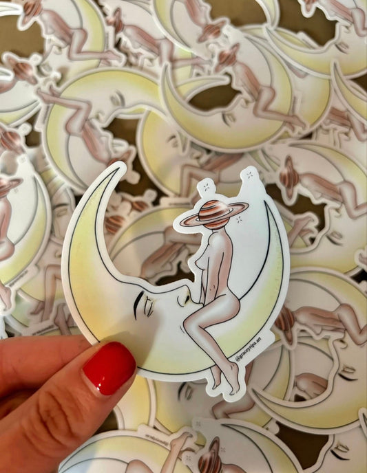 A hand holding stickers to show the size reference.