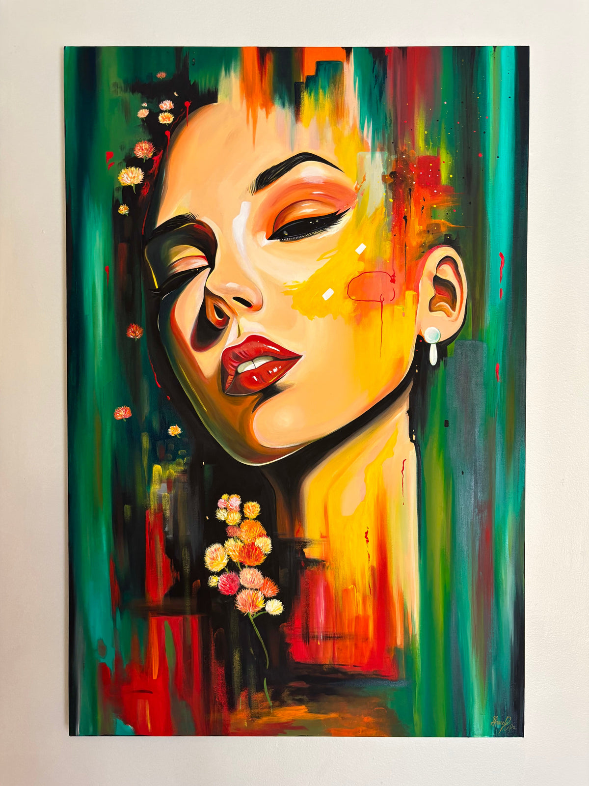 An abstract acrylic painting of a woman’s face. The colors are real, yellow, and red. There are glitches and texture with the paint. She has her face pointed up and looking down at you. 
