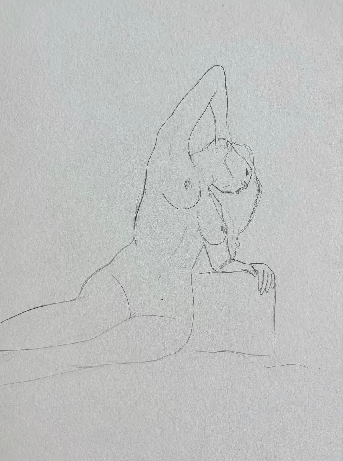 Sketch of a nude woman on a light grey background. The woman is lying down with her arm stretched behind her hair. 