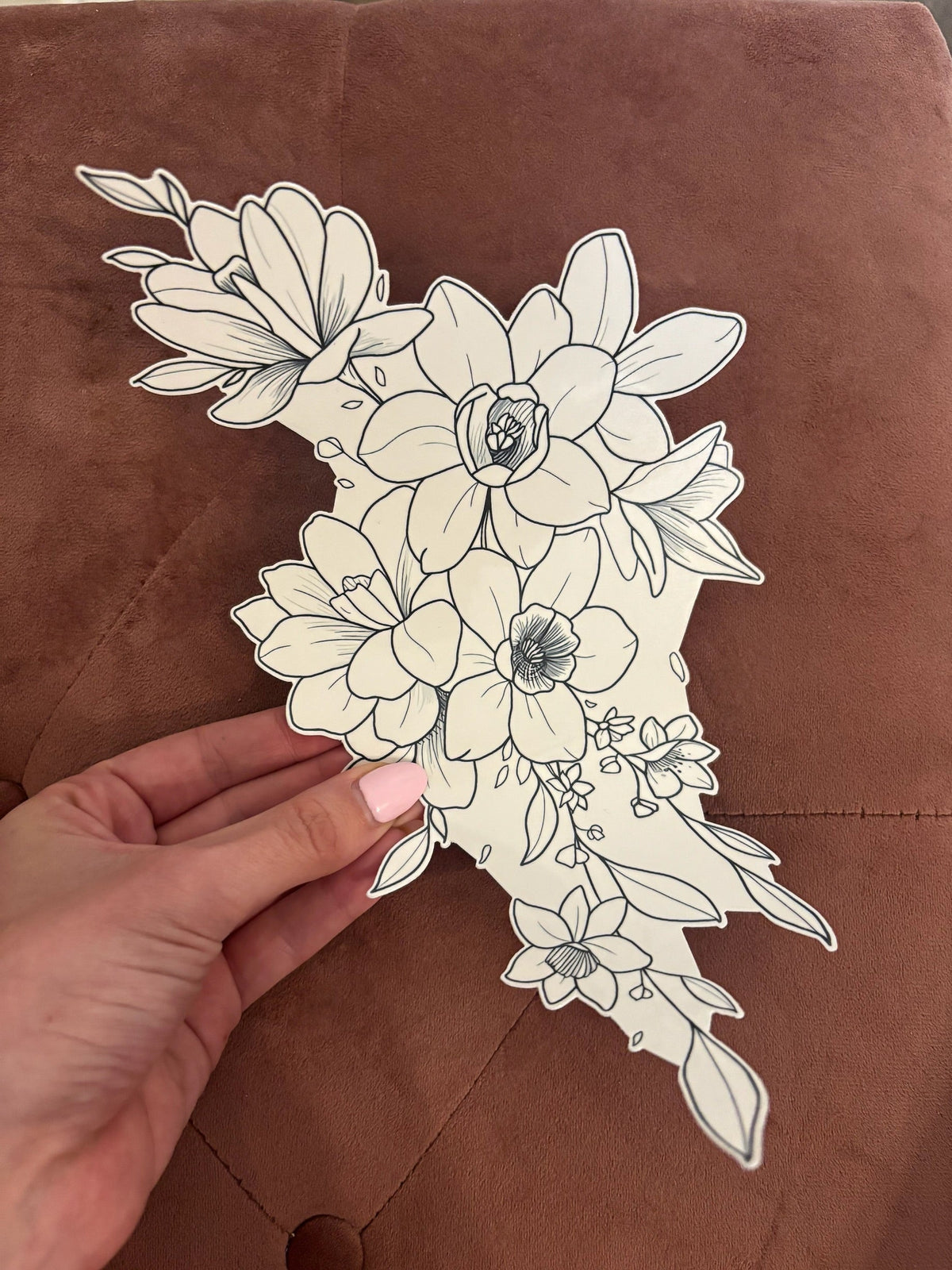 A large floral temporary tattoo, with Gracey’s hand for scale. 