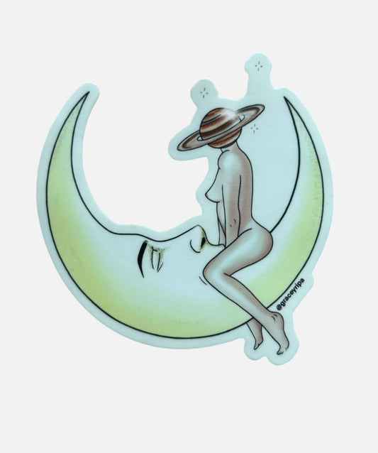 A decorative sticker featuring an illustration of a woman's face on the moon with a space-themed background, sitting on a crescent moon.
