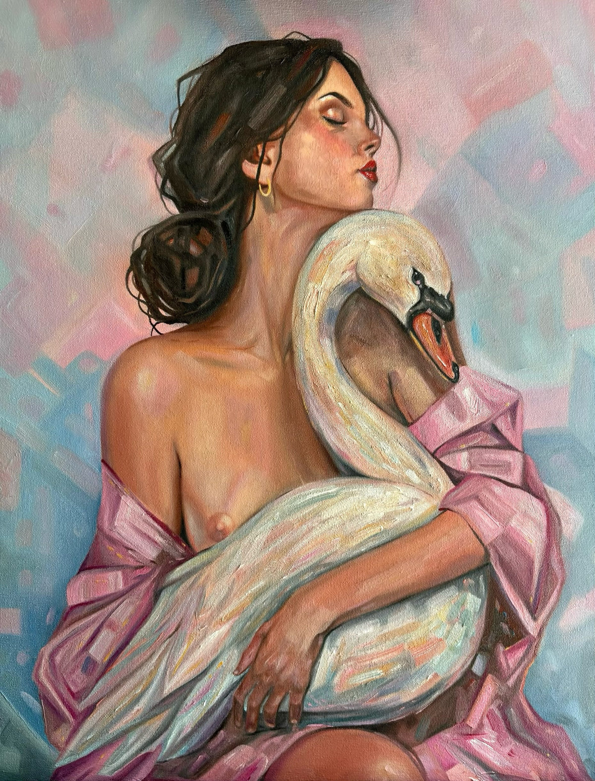 An oil painting of a woman with dark hair embracing a white swan, draped in pink fabric against a pastel pink and blue background.