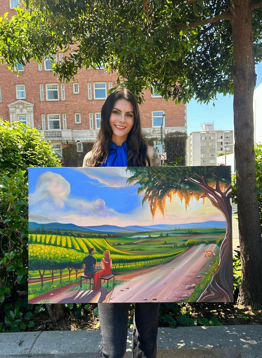 Gracey Ripa holding the large painting of “The Winery” oil painting. 